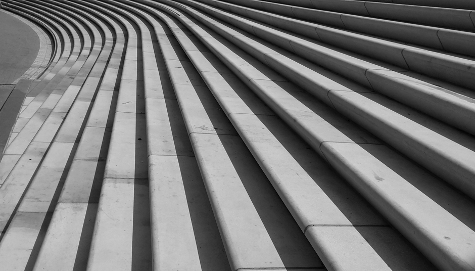 Modern architectural steps representing progression and succession solutions for business owners